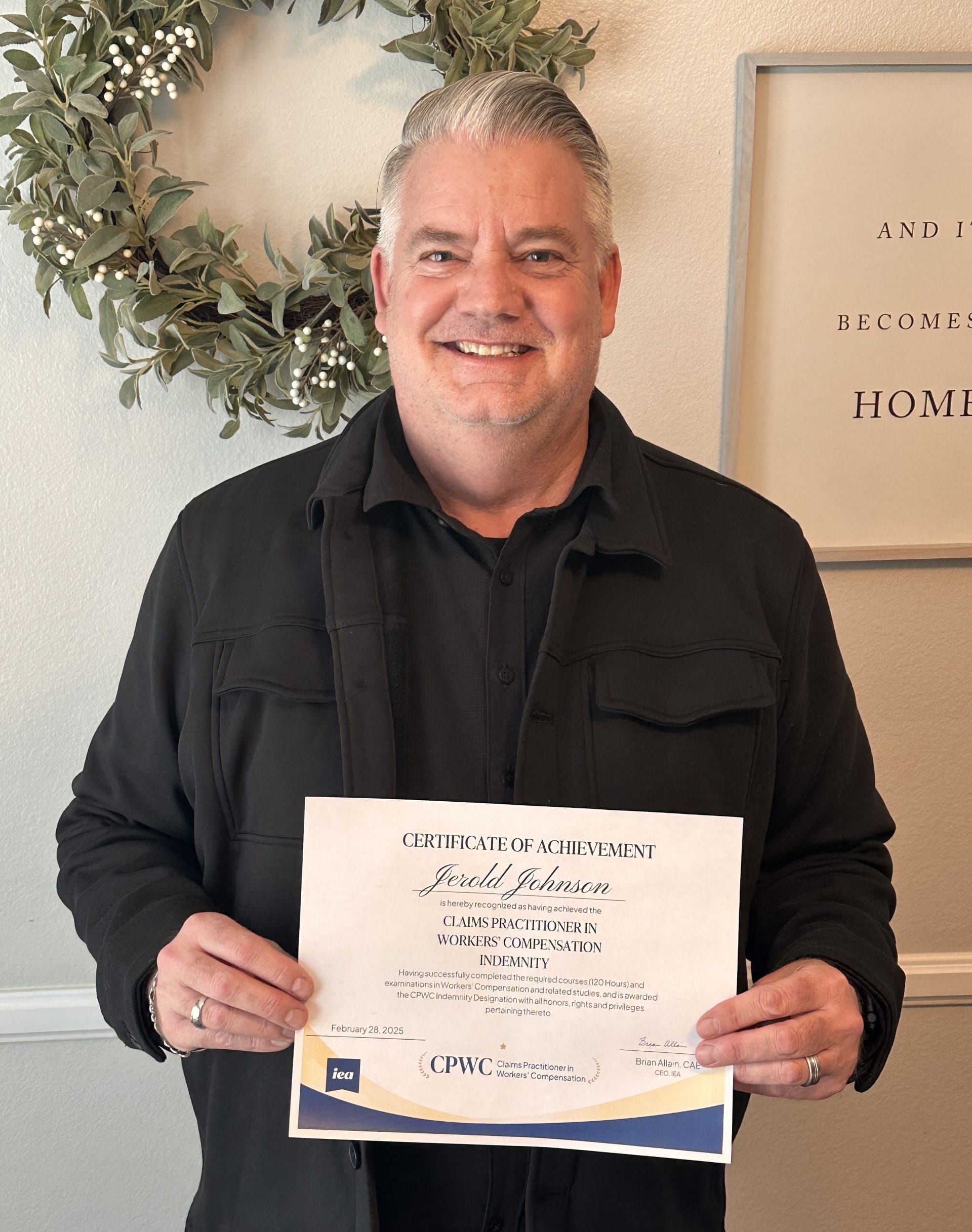 a man holding a certificate