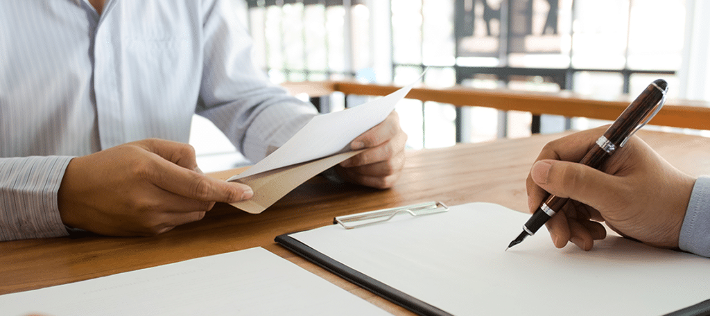 people reviewing documents at a desk