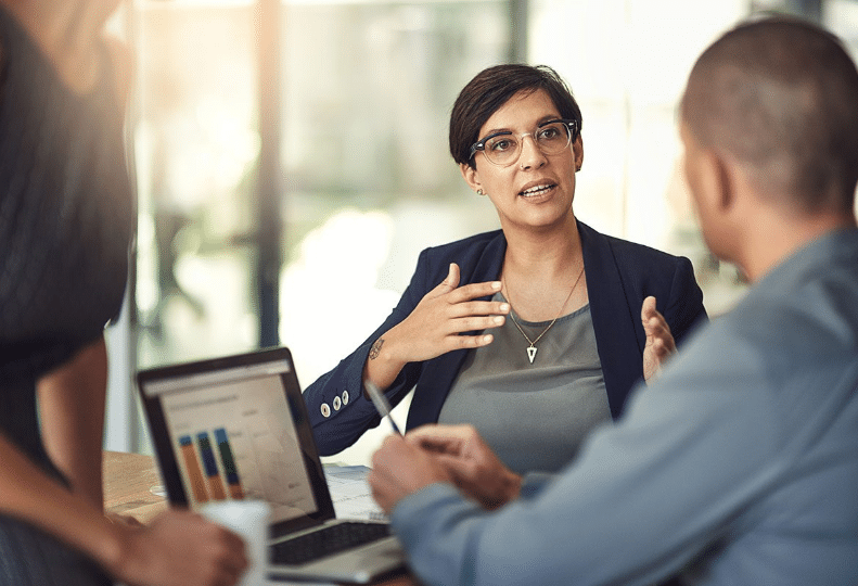 a woman talking to a man