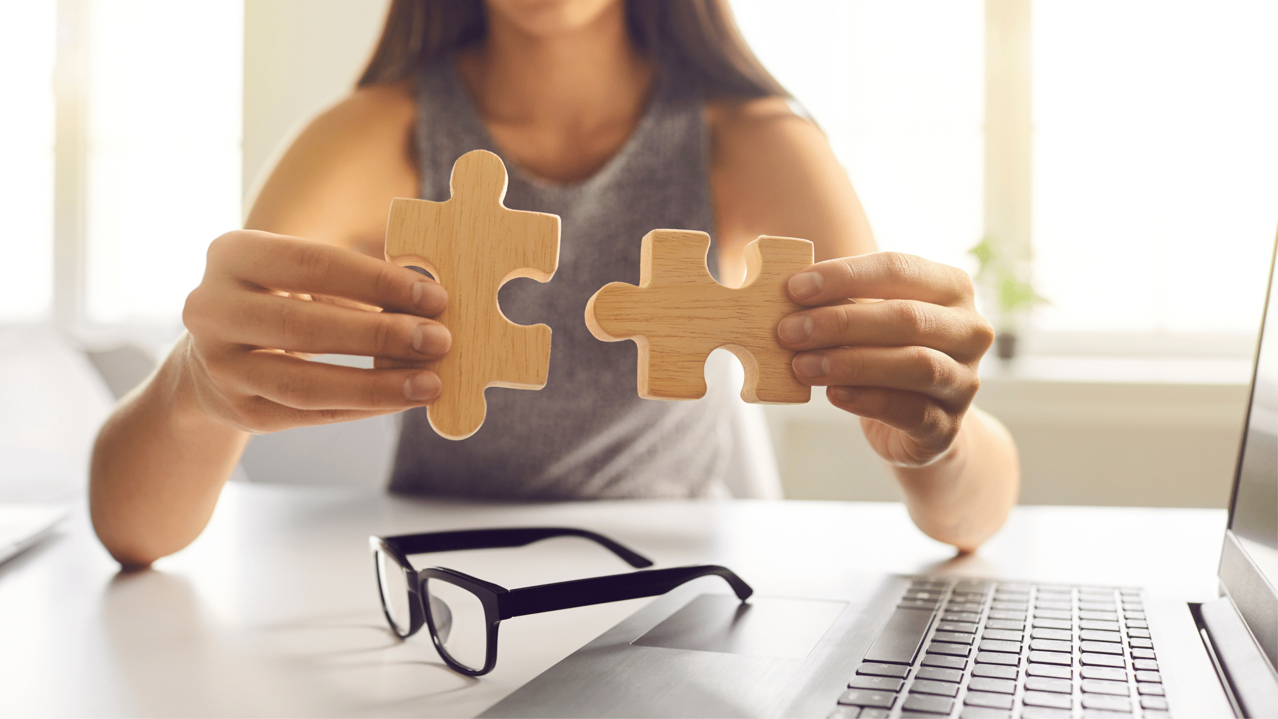 Person putting together pieces of jigsaw