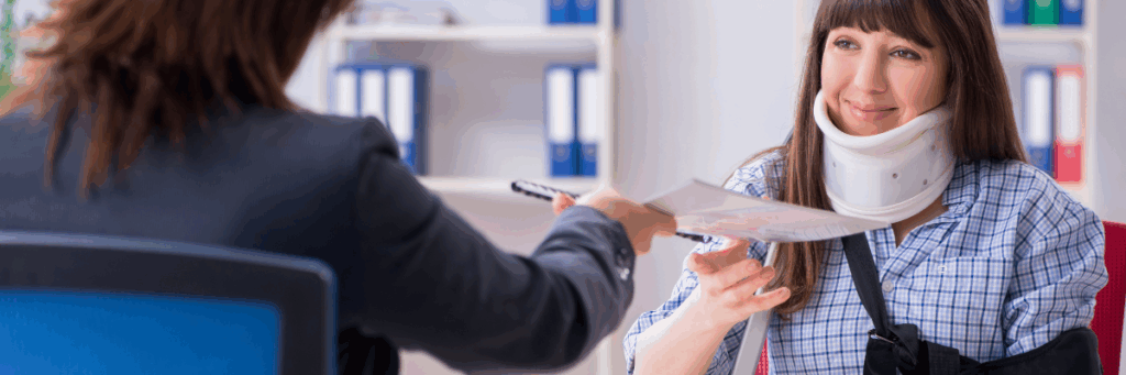 Woman with injured neck wearing neck brace