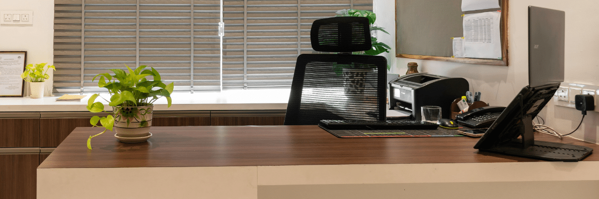 office setup with laptop, printer, and landline